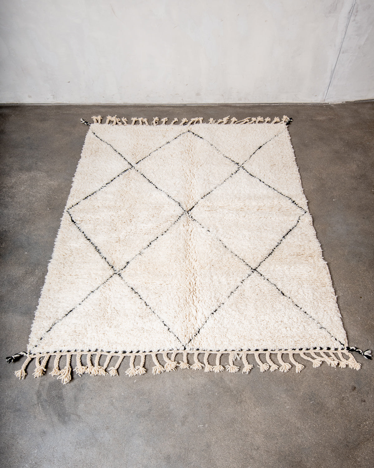 Modern, designer, handcrafted Berber rug from Morocco. Beniourain carpet with minimalist design, natural wool pile and a fluffy texture.